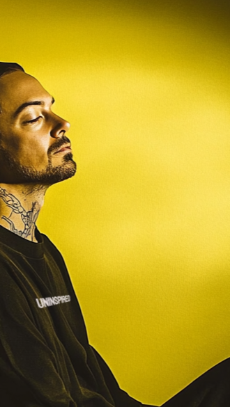 u8815896537_Side_profile_of_a_man_in_a_black_hoodie_seated_in_3_1_605348a3-2b43-4329-a04a-ed73b87e7f12.png